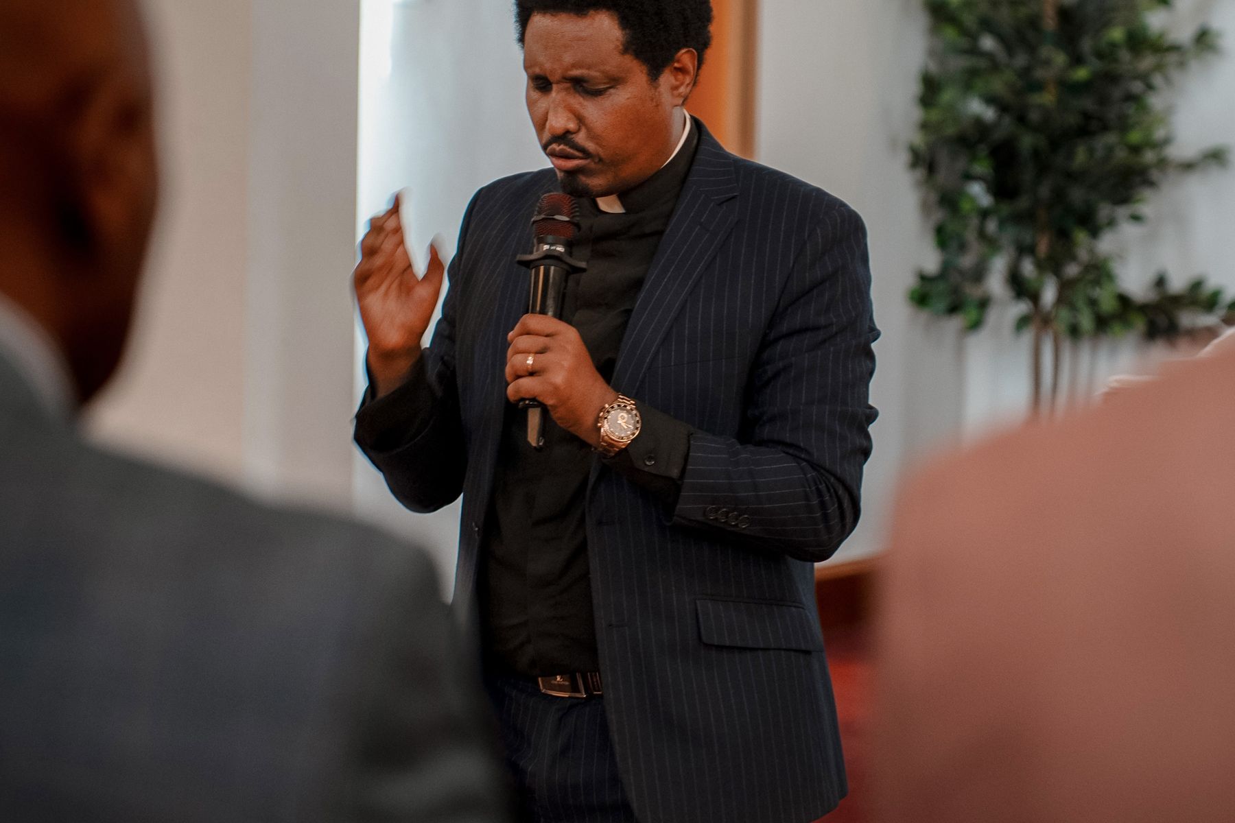 Pastor speaking to a congregation during a church service